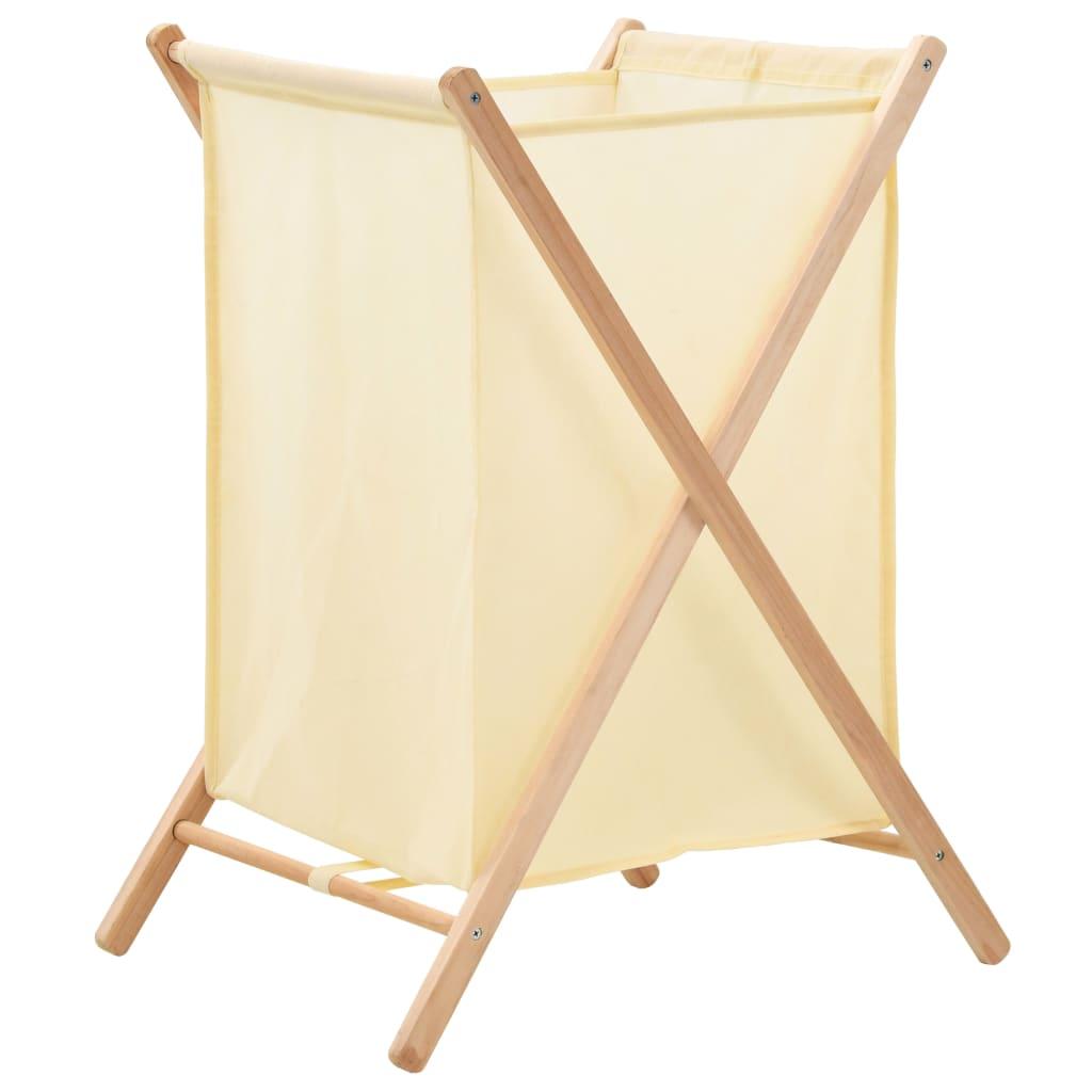 Foldbar beige stofkurv i et krydsformet stel af cedertræ